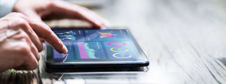 KPI Dashboard Financial Business Graph On Tabletの写真素材