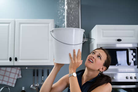 Ceiling Water Leak From Ceiling In Kitchen At Homeの写真素材