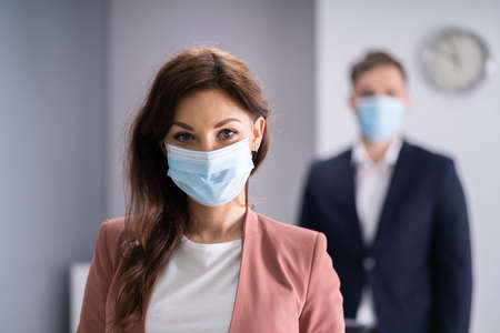 People Waiting In Line. Standing In Queue Wearing Medical Face Maskの写真素材