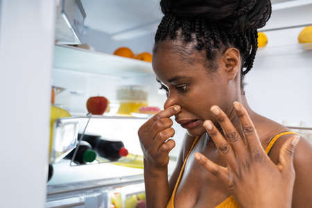 Rotten Fruit Bad Smell In Open Fridge Or Refrigeratorの写真素材