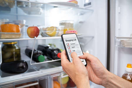 Consumer Grocery Shopping List App And Fridgeの写真素材