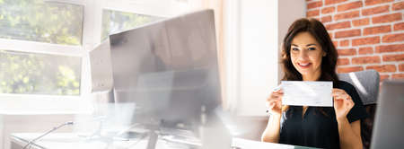 Women Holding Payroll Check With Salary. Paycheck Insurance