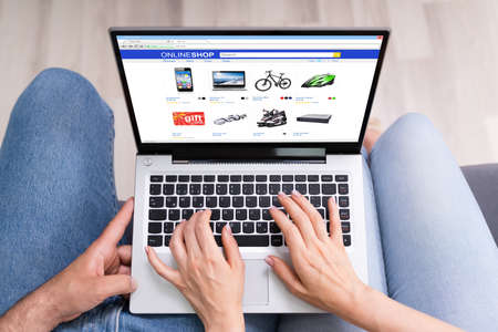 Couple Shopping Electronics Online In Ecommerce Shop