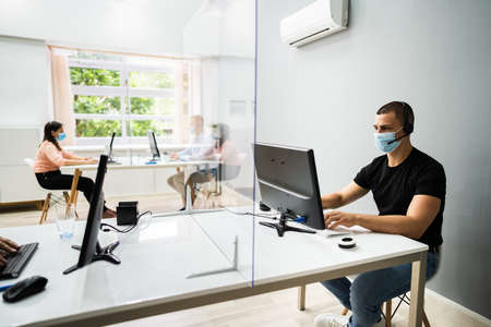 Call Center Customer Service Agents Wearing Face Masksの写真素材