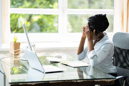 African Business Woman Tired And Upset With Head Acheの写真素材