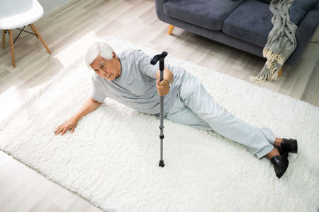 Elderly Senior Man Slip And Fall. Fallen Old Personの写真素材
