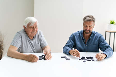 Elder Old Senior Playing Domino Table Game