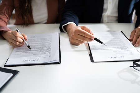 Lawyer People Review Document Before Signing In Office