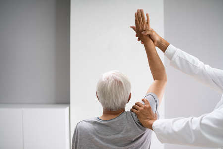 Physical Rehabilitation Therapy Exercise After Shoulder Injuryの写真素材