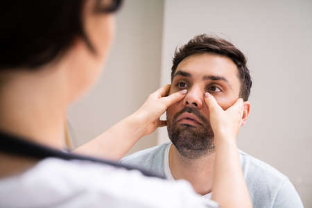 Physician Doctor Doing Sinusitis Examination For Sinus Inflammation