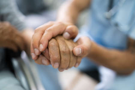 Elder Patient Helping Nurse Hand And Careの写真素材
