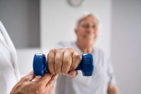Physical Therapy Elderly Therapist In Physiotherapy Rehab Trainingの写真素材