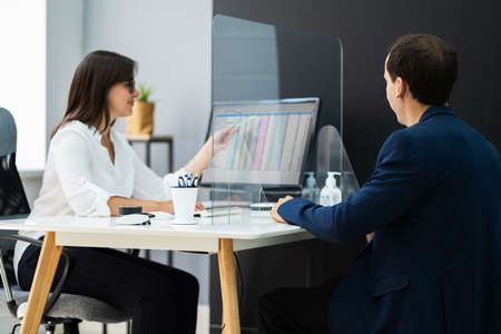 Financial Advisor Meeting With Client Customer Protected Using Sneeeze Guard