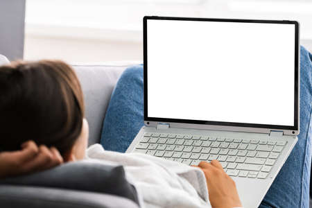 Woman At Home Room With Blank Laptop Computerの写真素材
