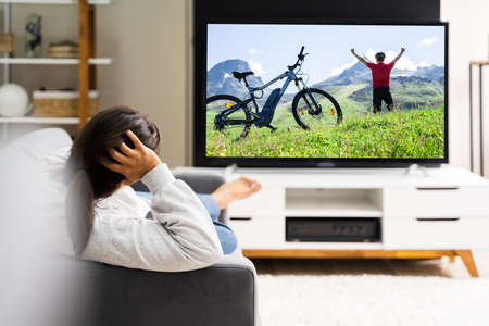 Women Watching TV At Home. Television Movieの写真素材