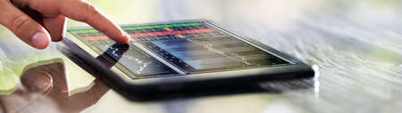 Stock Broker Online Exchange Technology On Tabletの写真素材