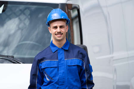 Happy Electrician Or Plumber Near Van Vehicle