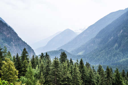 Alps Mountains. Alpine Austria Mountain With Clouds
