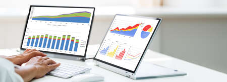 Analyst Women Looking At KPI Data On Computer Screen
