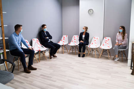 Diverse Job Applicants Waiting For Interview In Face Masks