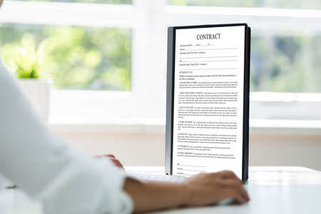 Employee Job Application Contract On Computer. Banking And Finance