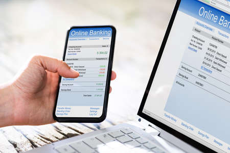 Online Banking Balance On Mobile Phone And Laptop