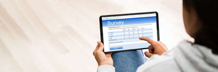 Filling Online Survey Form. Adult Feedback Ratingの写真素材