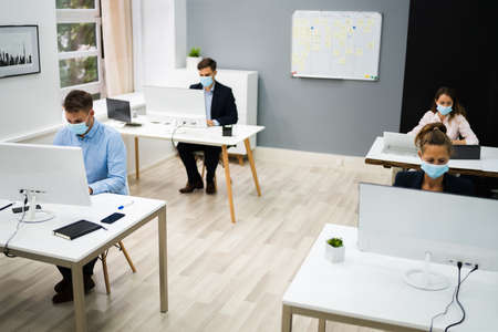Business Team Training. Working On Computer With Face Mask