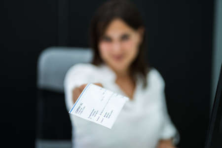 Employee Payroll Cheque. Handing Or Giving Salary Checkの写真素材