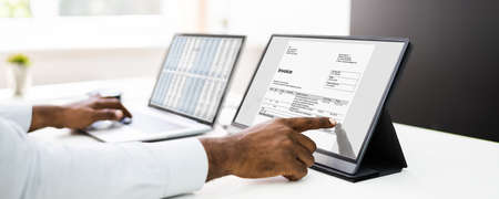 Analyze Spreadsheet Data On Laptop At Workの写真素材