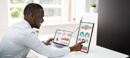 Predictive Business Analytics. African American Analyst Using Computerの写真素材