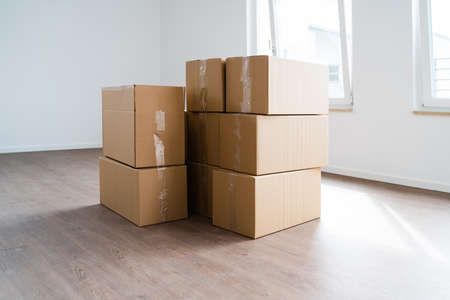 Empty Room With Moving Boxes Or Cartonsの写真素材