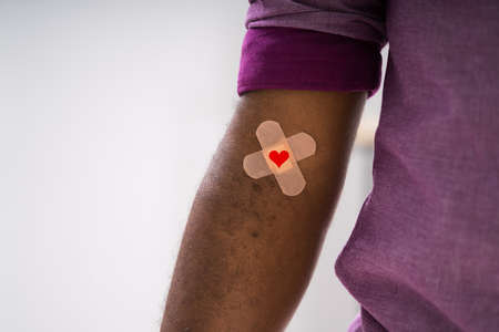 Blood Donation Concept. African American Donor With Band plaster And Heart