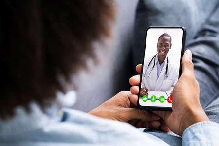 African American Video Conferencing With Doctor. Online Telemedicineの写真素材
