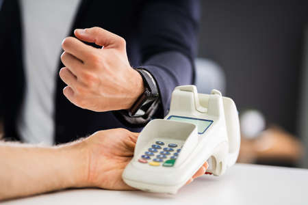 Contactless Mobile Payment Using Smart Watch And NFC Wireless Terminalの写真素材