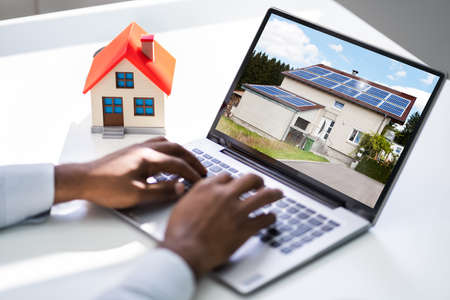 Looking Real Estate Home Or House On Laptop Computer