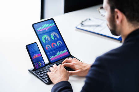 KPI Business Analytics Data Dashboard. Analyst Using Tablet Computer