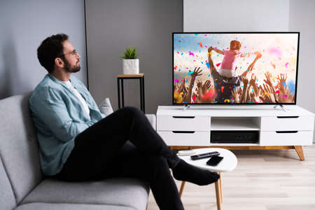 Watching TV Movie On Couch In Living Room
