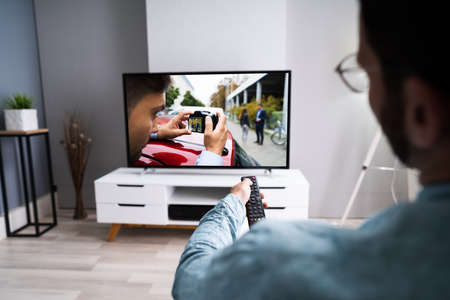 Watching TV Movie On Couch In Living Room
