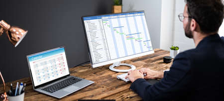 Scheduling Report List And Gantt Chart On Computer Screenの写真素材