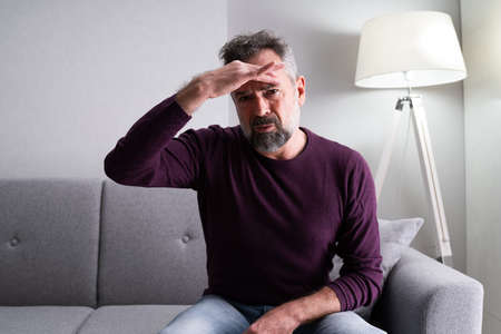 Man With Headache. Bored And Sad Having Depression