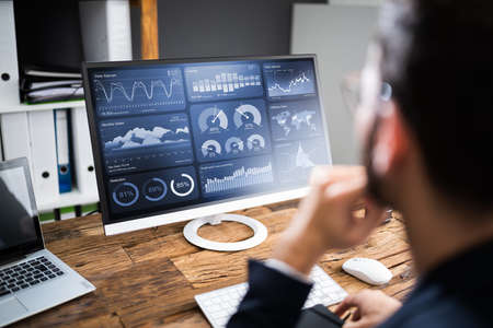 KPI Business Analytics Data Dashboard. Analyst Using Computer