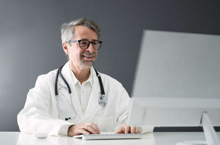 Senior Older Man Doctor Computer Video Conference
