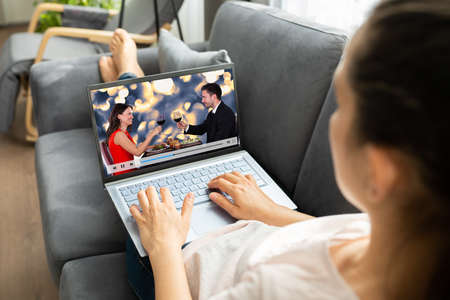Watching TV Video On Laptop At Sofa Or Couchの写真素材