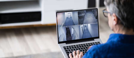 CCTV Security Camera Surveillance Video Footage On Tablet