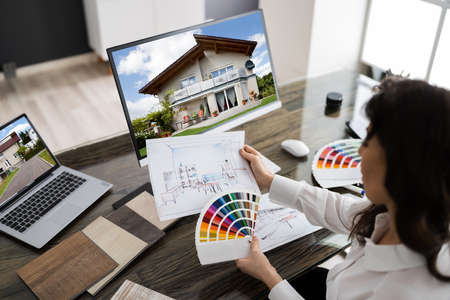 Interior Designer Or Architect Working With Sketch And Color Palette