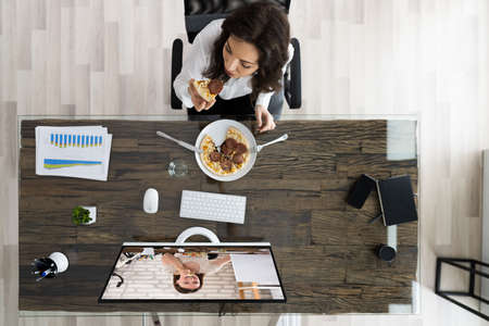 Virtual Office Lunch Break Using Online Video Conferenceの写真素材