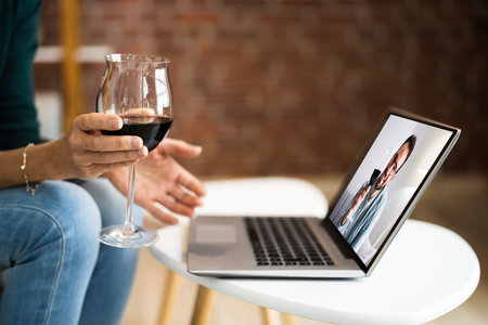 Virtual Wine Tasting Dinner Event Online Using Laptopの写真素材