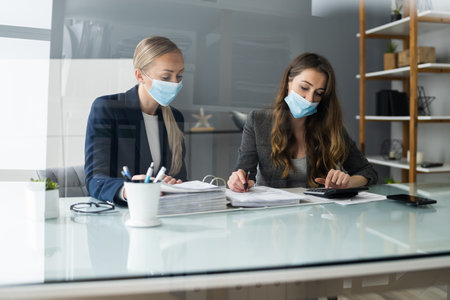 Consultant Advisor With Sneeze Guard And Social Distancingの写真素材