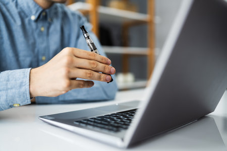 Virtual Smoking Break Using Electronic Cigarettes And Video Conferenceの写真素材